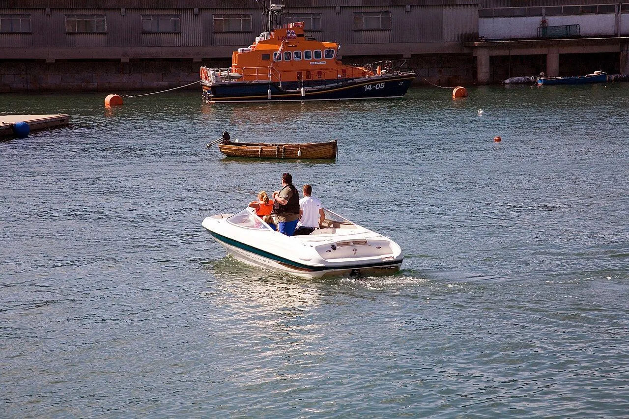 Members of the crew float on the last of the ebb