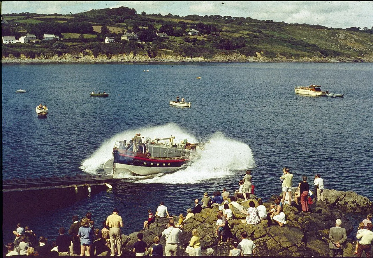 RNLI lifeboat launching down a slipway into the sea
