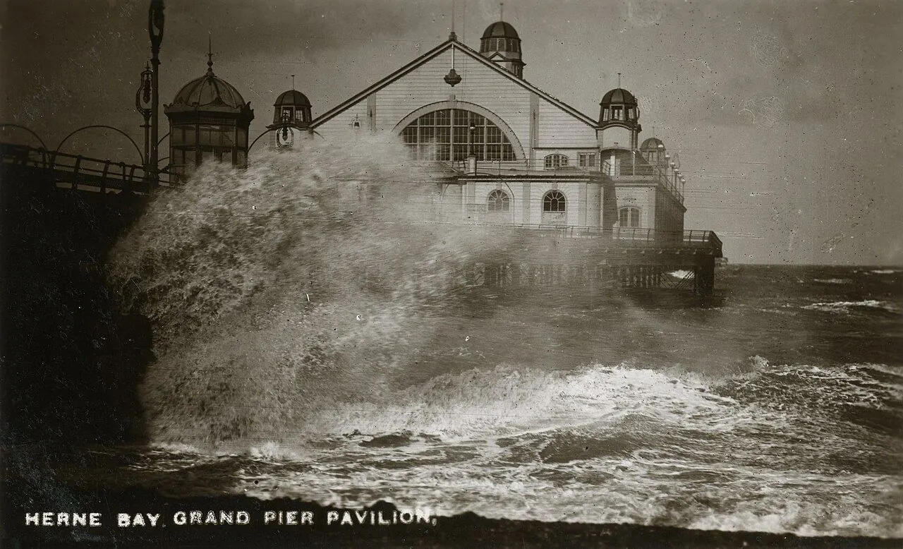 White horses on a windswept grey sea