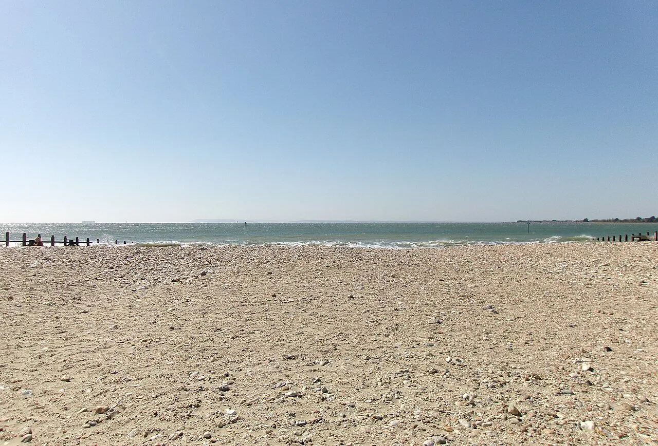 Wide sandy beach at low tide in West Sussex