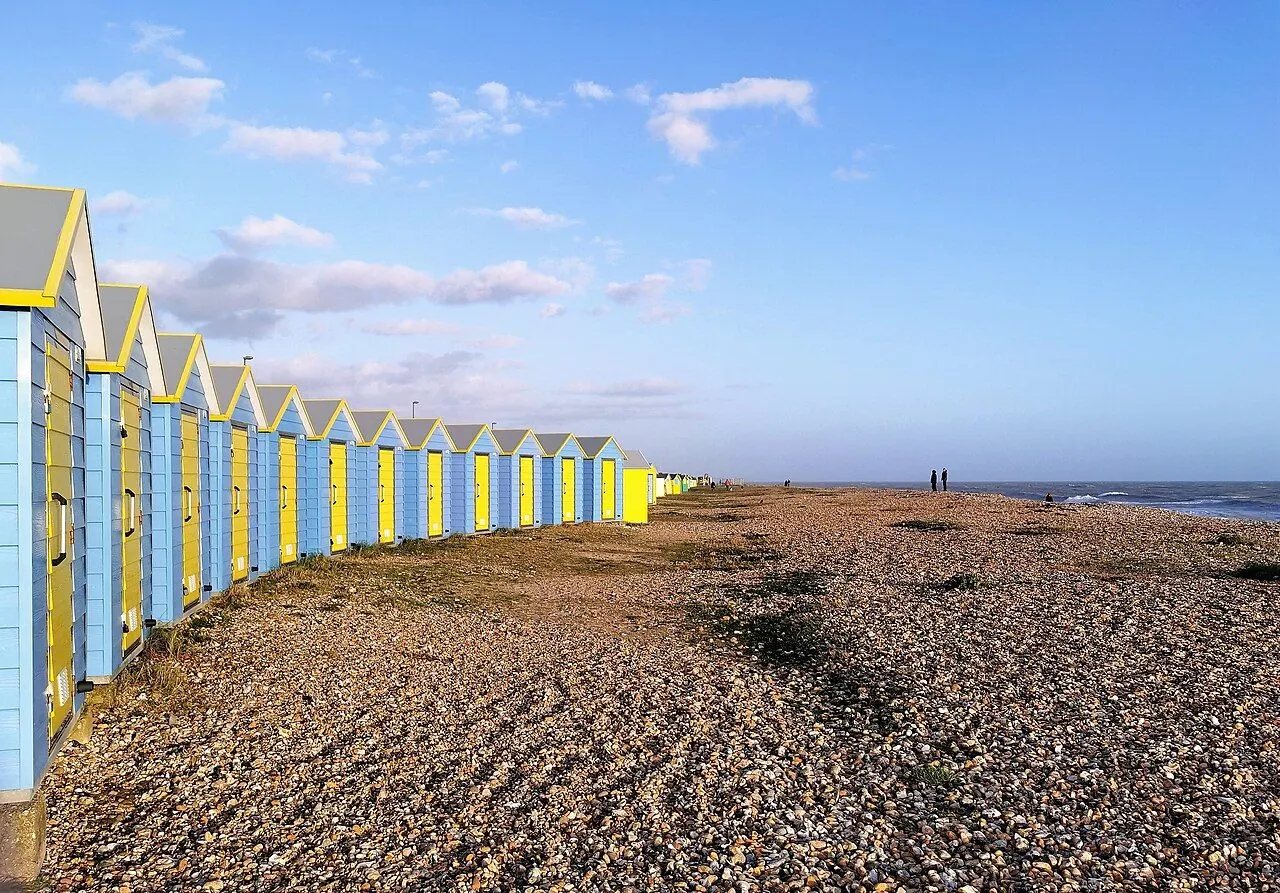 Colourful long wooden bench on a seaside promenade